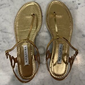 Aquazzura “Barely There” Metallic Gold T-Strap Leather Sandals